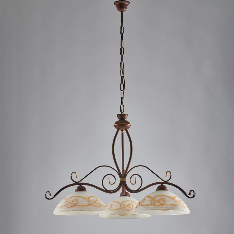 Lustre travaillé en fer noir rouillé finition dorée, trois lumières 71x h56 cm